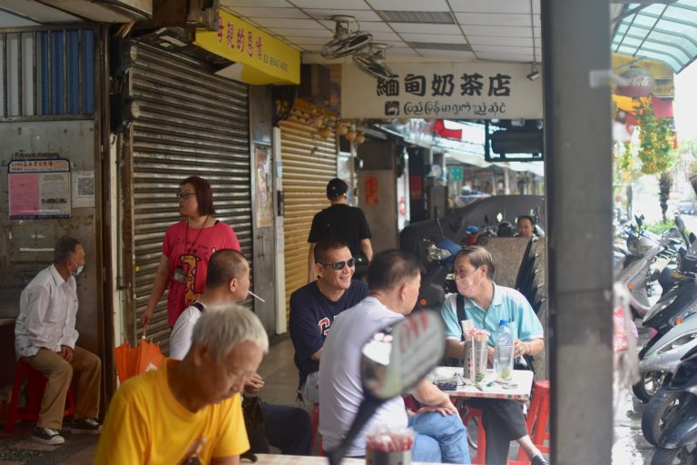 A group of men enjoys an afternoon cup of Myanmar milk tea at a tea shop on Huaxin Street, in New Taipei City, on August 12. (Allegra Mendelson | Frontier)