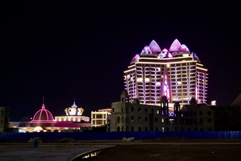 The Kapok Star Hotel and attached casinos beside vacant lots and unfinished buildings in Laos's Golden Triangle Special Economic Zone in June last year. (Andrew Nachemson | Frontier)