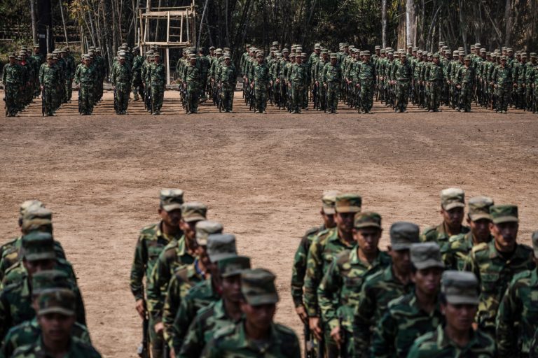 Members of the Ta'ang National Liberation Army take part in a training exercise at a base camp in northern Shan State on March 8, 2023. (AFP)